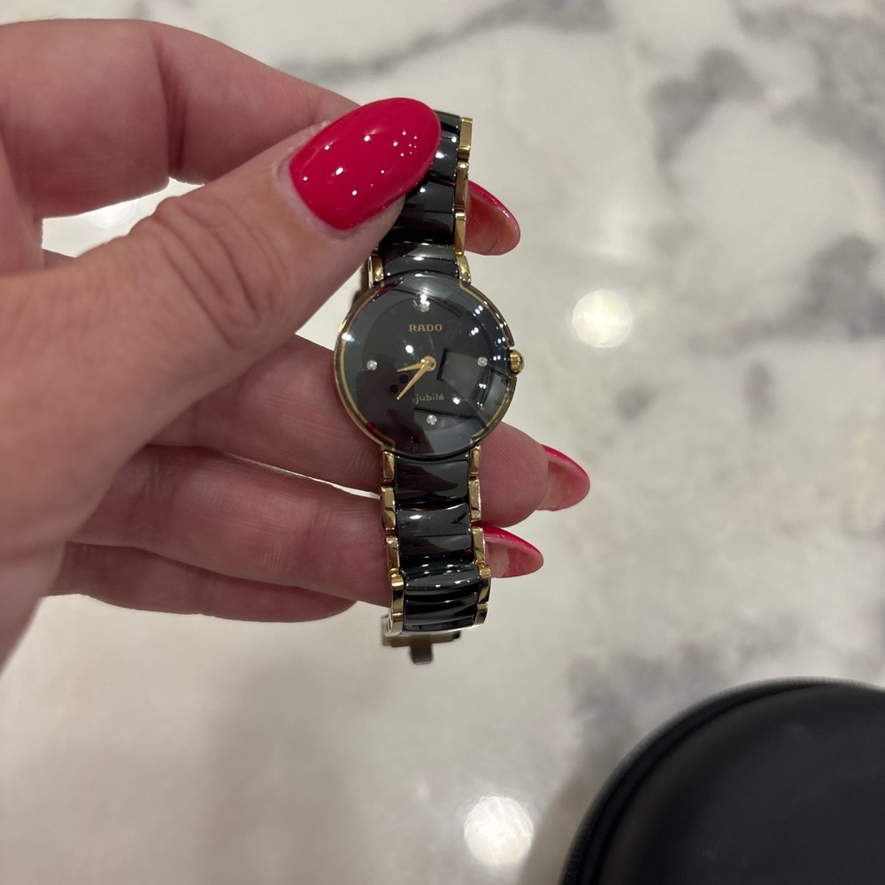 Rado Luxurious Black and Gold Timepiece